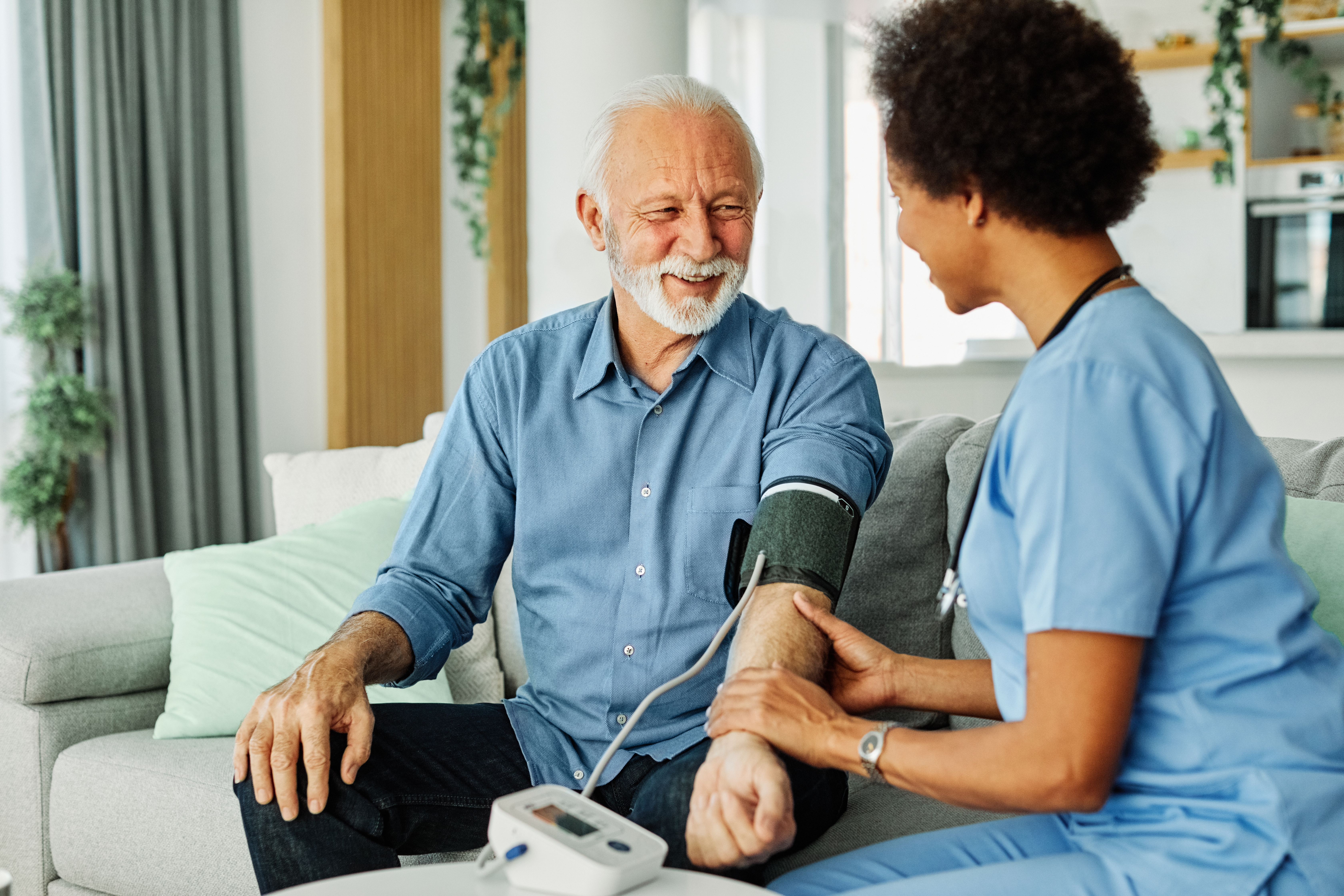 Nurse taking care of senior man